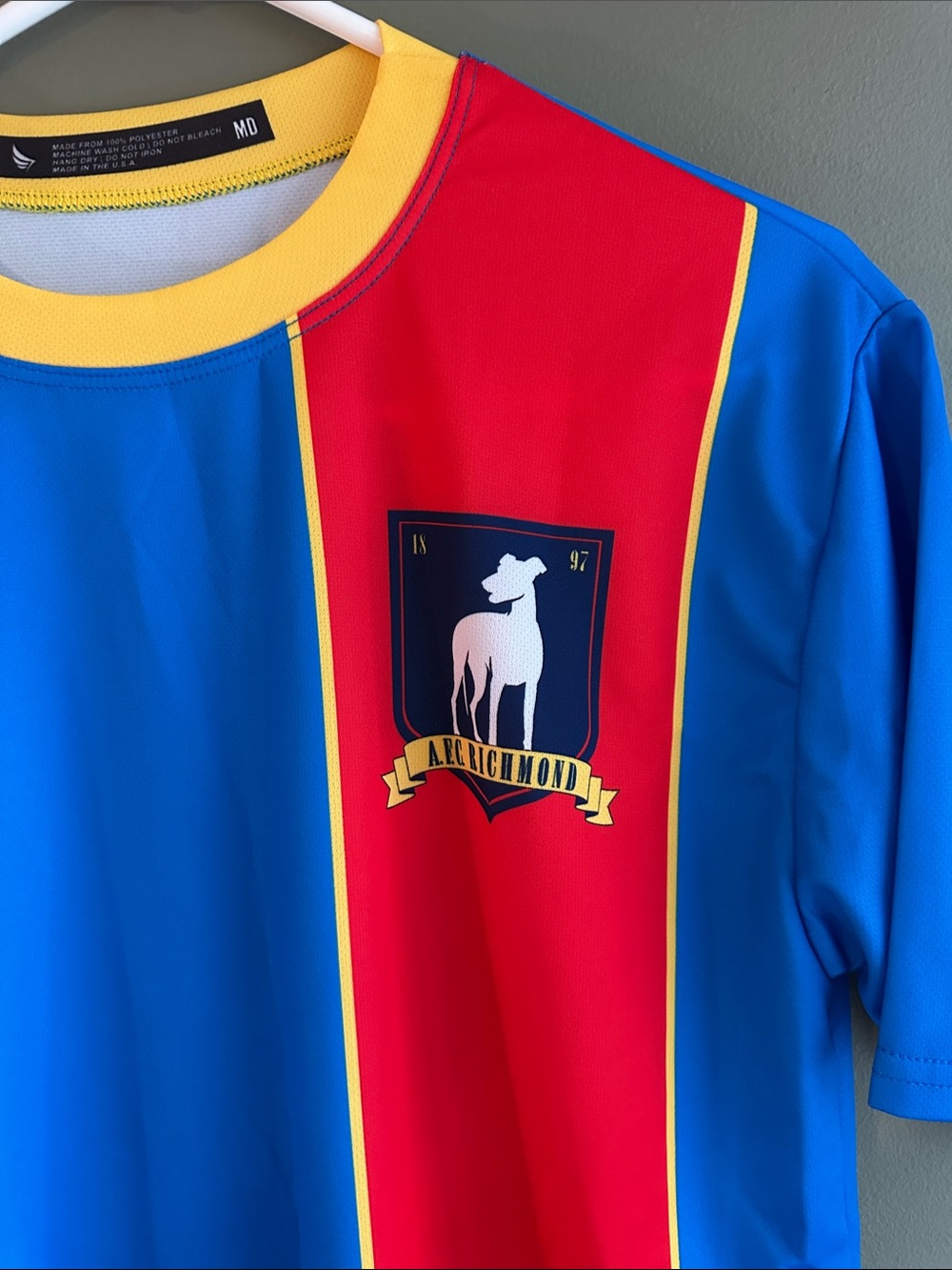 Ted Lasso Blue and Red Athletic Jersey with Yellow Trim - Picture 2 of 4